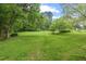 Large backyard featuring expansive green space perfect for recreation and outdoor enjoyment at 502 Hiddenbrook Dr, Durham, NC 27703