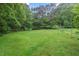 Expansive grassy backyard, perfect for outdoor activities and relaxation at 502 Hiddenbrook Dr, Durham, NC 27703