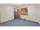 Cozy bedroom with carpeting, natural light, and wood trim at 502 Hiddenbrook Dr, Durham, NC 27703
