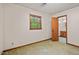 Bedroom featuring olive carpet and ensuite bathroom at 502 Hiddenbrook Dr, Durham, NC 27703