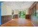 Bright dining room features hardwood floors, a chandelier, and sliding door access to the backyard at 502 Hiddenbrook Dr, Durham, NC 27703