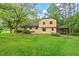 Exterior view featuring a carport, landscaping, and classic architecture at 502 Hiddenbrook Dr, Durham, NC 27703