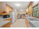 Traditional kitchen featuring wood cabinets, tiled countertops, and tiled floors at 502 Hiddenbrook Dr, Durham, NC 27703