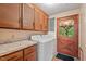 Functional laundry room features washer, dryer, and ample cabinet space at 502 Hiddenbrook Dr, Durham, NC 27703