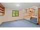 Open concept living room with adjacent kitchen and large windows at 502 Hiddenbrook Dr, Durham, NC 27703