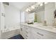 Bathroom featuring double sink vanity and soaking tub at 510 N Waters Edge Dr, Durham, NC 27703