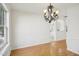 Open-concept dining room with hardwood floors and decorative chair rail at 510 N Waters Edge Dr, Durham, NC 27703