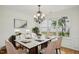 Bright dining room featuring an elegant chandelier and large windows at 510 N Waters Edge Dr, Durham, NC 27703