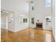 Bright living room with high ceilings, a fireplace, and large windows offering scenic views at 510 N Waters Edge Dr, Durham, NC 27703