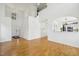 Open-concept living space features hardwood floors, an arched doorway, and natural light at 510 N Waters Edge Dr, Durham, NC 27703