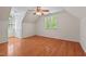 A bedroom featuring a vaulted ceiling, hardwood floors, a ceiling fan and natural light at 524 Preston Andrews Rd, Bahama, NC 27503
