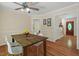 Bright dining area featuring hardwood floors and a rustic wooden table with seating for four at 524 Preston Andrews Rd, Bahama, NC 27503