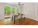 Bright dining area featuring hardwood floors, modern chairs, and a walk-out to a private deck at 524 Preston Andrews Rd, Bahama, NC 27503