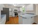 Well-lit kitchen featuring stainless steel appliances and ample counter space at 524 Preston Andrews Rd, Bahama, NC 27503