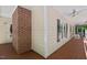 Covered porch with wood flooring, brick accent, and views of the surrounding landscape at 524 Preston Andrews Rd, Bahama, NC 27503