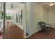 Spacious porch with rocking chairs offers a scenic view, perfect for relaxing and enjoying the outdoors at 524 Preston Andrews Rd, Bahama, NC 27503