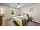 Cozy bedroom with a comfortable bed, soft lighting, and a serene atmosphere for a restful night's sleep at 5300 Whippoorwill St, Durham, NC 27704