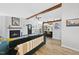 Spacious living area with vaulted ceilings, a fireplace, and an open floor plan perfect for entertaining guests at 5300 Whippoorwill St, Durham, NC 27704
