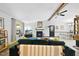 Inviting living room featuring a fireplace, vaulted ceiling, and modern furnishings for relaxation and entertainment at 5300 Whippoorwill St, Durham, NC 27704