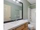 Well-lit bathroom with a bathtub, shower, vanity, and tile flooring at 55 Ayden Dr, Clayton, NC 27520