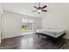 Bedroom with a ceiling fan, a window overlooking the backyard, and wood-look flooring at 55 Ayden Dr, Clayton, NC 27520