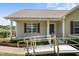 Accessible front entrance with ramp and well-maintained landscaping at 55 Ayden Dr, Clayton, NC 27520