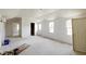 Bright, unfinished living room featuring ample natural light and high ceilings at 55 Ayden Dr, Clayton, NC 27520