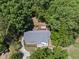 Aerial view of a home surrounded by mature trees and a private backyard deck at 556 Margaret Pl, Garner, NC 27529