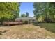 Spacious backyard featuring a large deck and a fire pit, offering outdoor enjoyment at 556 Margaret Pl, Garner, NC 27529