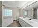 Bright bathroom with double sinks, soaking tub, and separate shower for a relaxing and functional space at 556 Margaret Pl, Garner, NC 27529