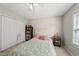 Bright bedroom featuring a ceiling fan, a book collection, and neutral decor at 556 Margaret Pl, Garner, NC 27529