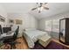 Vaulted ceiling bedroom with ceiling fan, window, desk, chair, queen bed, bench and area rug at 556 Margaret Pl, Garner, NC 27529