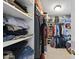 Walk-in closet with shelves and rods offers ample storage space at 556 Margaret Pl, Garner, NC 27529