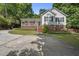 Charming exterior view of a home with a welcoming front porch and a well-maintained yard at 556 Margaret Pl, Garner, NC 27529