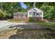 Charming exterior view of a home with a welcoming front porch and a well-maintained yard at 556 Margaret Pl, Garner, NC 27529