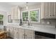 Well-lit kitchen featuring lots of counterspace and sink beneath a window at 556 Margaret Pl, Garner, NC 27529