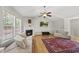 Bright living area includes a fireplace, hardwood floors, and ample seating at 556 Margaret Pl, Garner, NC 27529
