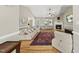 Spacious living room with ample natural light, fireplace, and hardwood flooring at 556 Margaret Pl, Garner, NC 27529