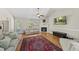 Bright living room featuring a fireplace, ceiling fan, and hardwood floors at 556 Margaret Pl, Garner, NC 27529
