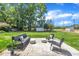 Spacious backyard patio featuring a comfortable seating area and serene green surroundings at 5718 Woodcrest Dr, Raleigh, NC 27603