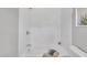 Clean bathroom featuring a white tiled shower and a neutral color scheme at 5718 Woodcrest Dr, Raleigh, NC 27603