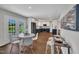 Open dining area featuring modern furnishings, vinyl plank flooring, and easy access to the updated kitchen at 5718 Woodcrest Dr, Raleigh, NC 27603