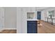 Modern kitchen featuring white cabinets, hardwood floors, and a stylish countertop at 5718 Woodcrest Dr, Raleigh, NC 27603