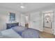 Inviting bedroom featuring natural light, a ceiling fan, vinyl floors, an en-suite bathroom, and closet space at 5718 Woodcrest Dr, Raleigh, NC 27603