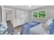 Inviting bedroom featuring natural light, a ceiling fan, vinyl floors, an en-suite bathroom, and closet space at 5718 Woodcrest Dr, Raleigh, NC 27603