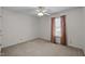 Bedroom featuring a ceiling fan, plush carpet, and curtains at 609 Chivalry Dr, Durham, NC 27703