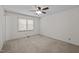 Bright bedroom featuring a ceiling fan and window with blinds at 609 Chivalry Dr, Durham, NC 27703