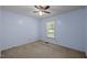 Cozy bedroom with a ceiling fan and a bright window at 609 Chivalry Dr, Durham, NC 27703