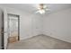 Bedroom with plush carpet, a closet, and neutral walls at 609 Chivalry Dr, Durham, NC 27703
