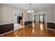 Open dining area seamlessly connects to kitchen and living spaces with hardwood floors and natural light at 609 Chivalry Dr, Durham, NC 27703